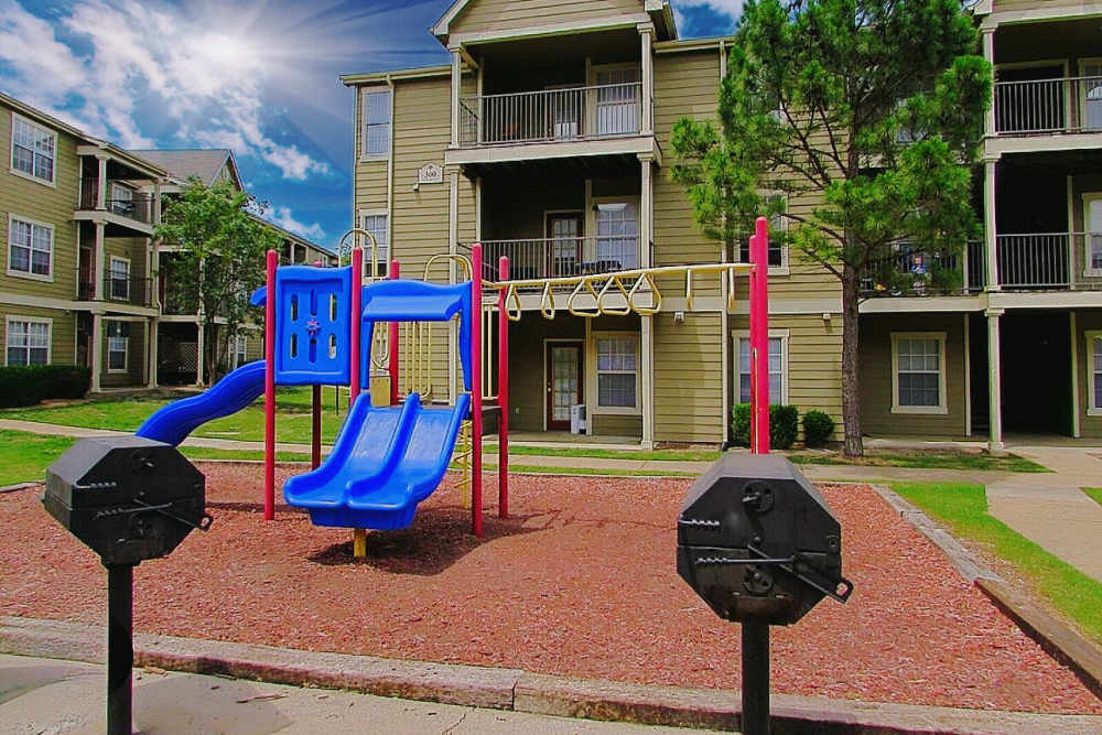 Community playground with sliders at Steeplechase in Coweta, Oklahoma