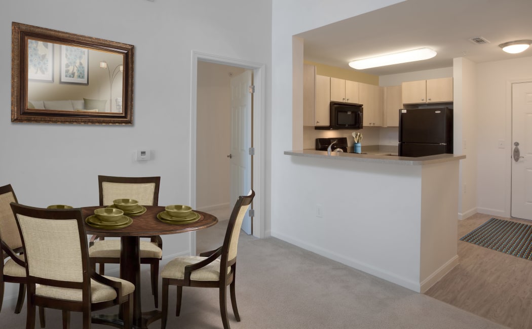 Dining area and adjacent kitchen in model home at Prynne Hills in Randolph, MA