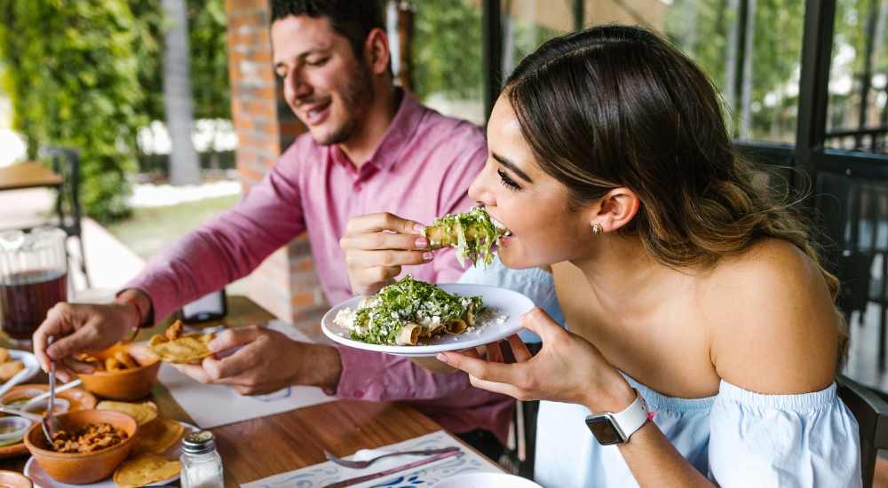 Resident couple dining out at a restaurant near Clayton Gardens in Concord, California