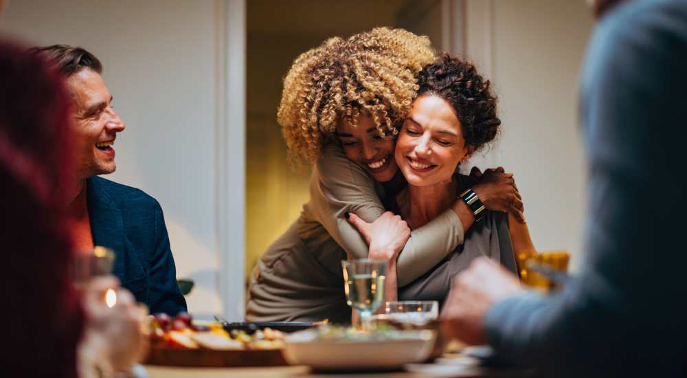 Residents having a dinner party at Tristan Townhomes in Garden City, Georgia
