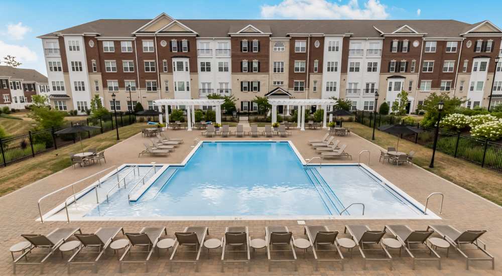 Community pool with lounge chairs at Meadow Branch Apartments in Winchester, Virginia 