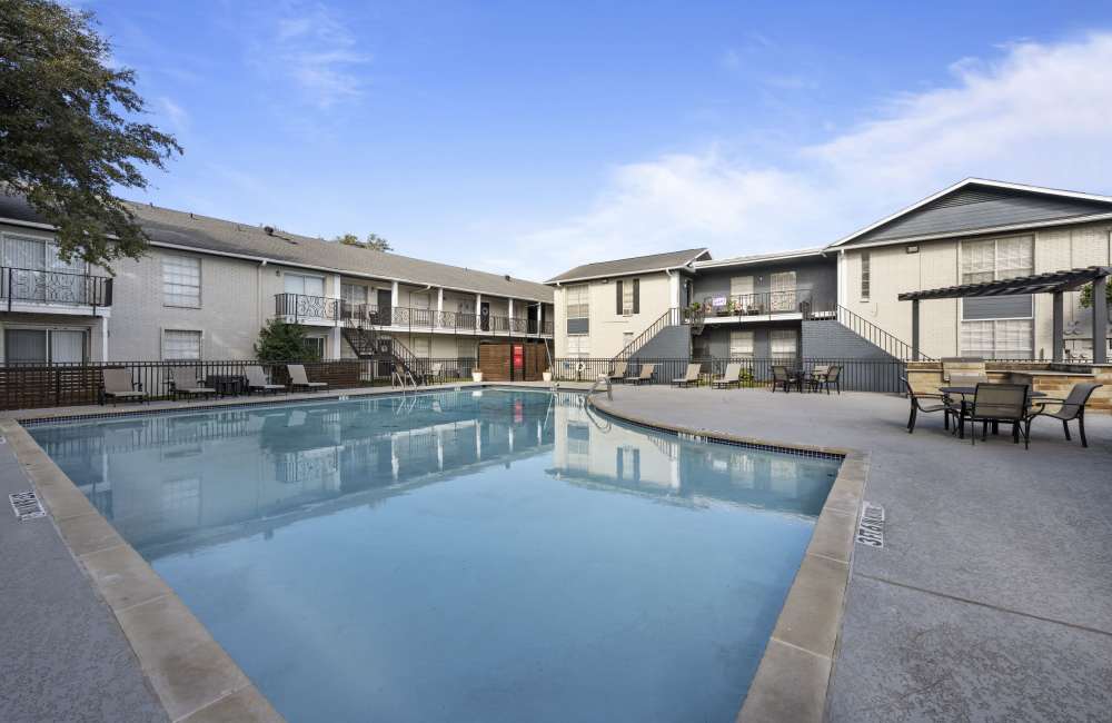 Exterior of the apartments with a car parking space at Lockwood Heights in Richardson, Texas