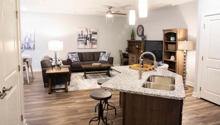 An open kitchen and living room at Attivo Trail Waukee in Waukee, Iowa