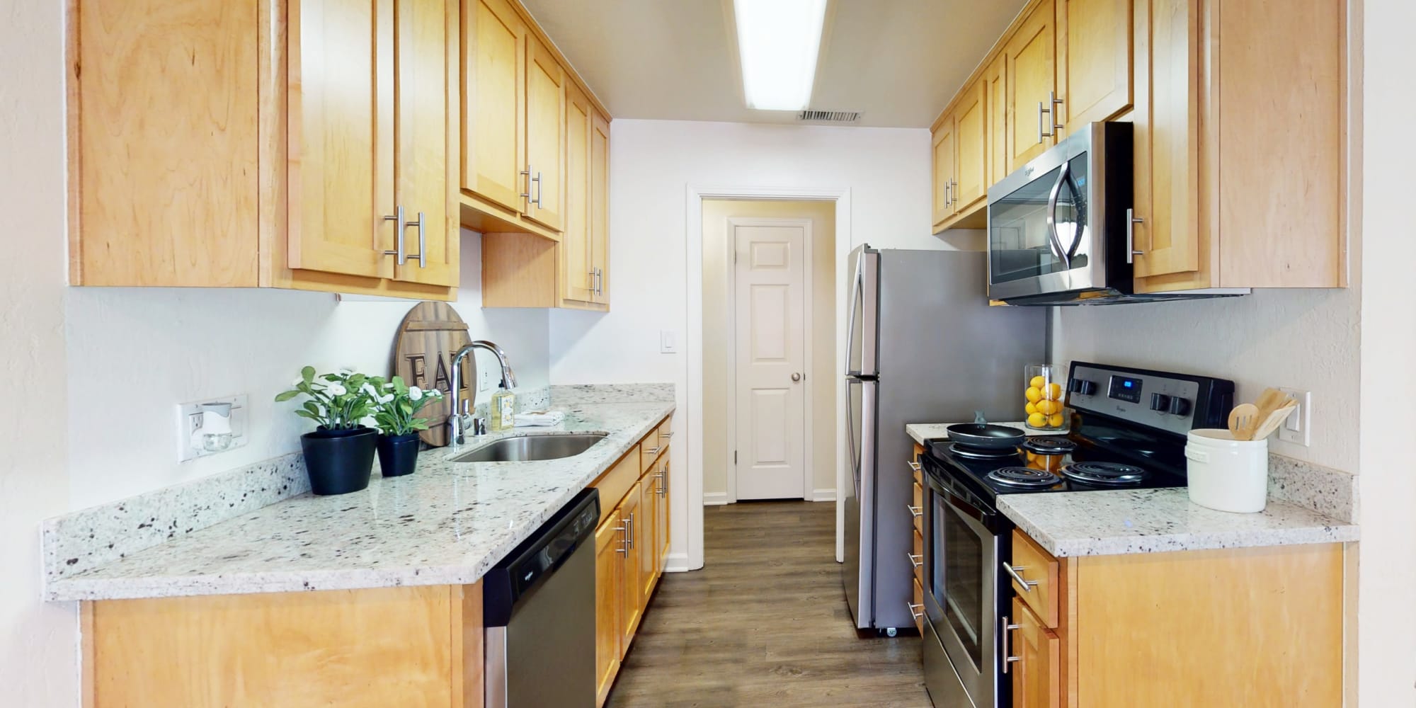 Stainless-steel appliances in a model apartment's kitchen at Pleasanton Glen Apartment Homes in Pleasanton, California