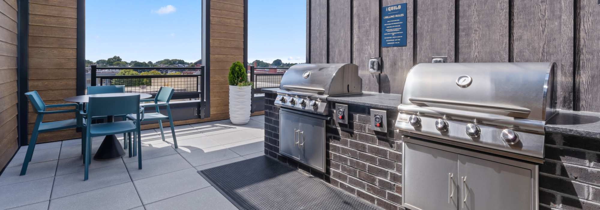 Community sky lounge with grillers at The Guild in Richmond, Virginia