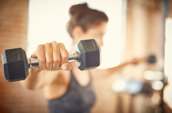 Resident at The Parks on Village getting workout in at our on-site fitness center