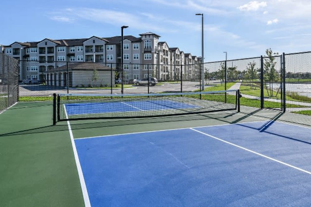 Tennis courts at Murano at Three Oaks in Fort Myers, Florida
