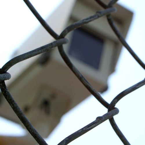 Security camera behind a chain link fence at Red Dot Storage in Topeka, Kansas