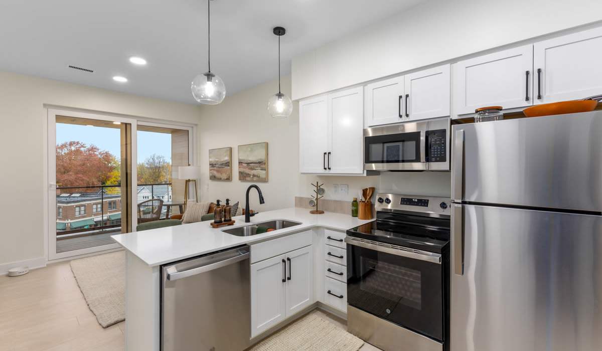 Bright L-Shaped Kitchen With Stainless Steel Appliances at The Current in Grand Rapids, Michigan 
