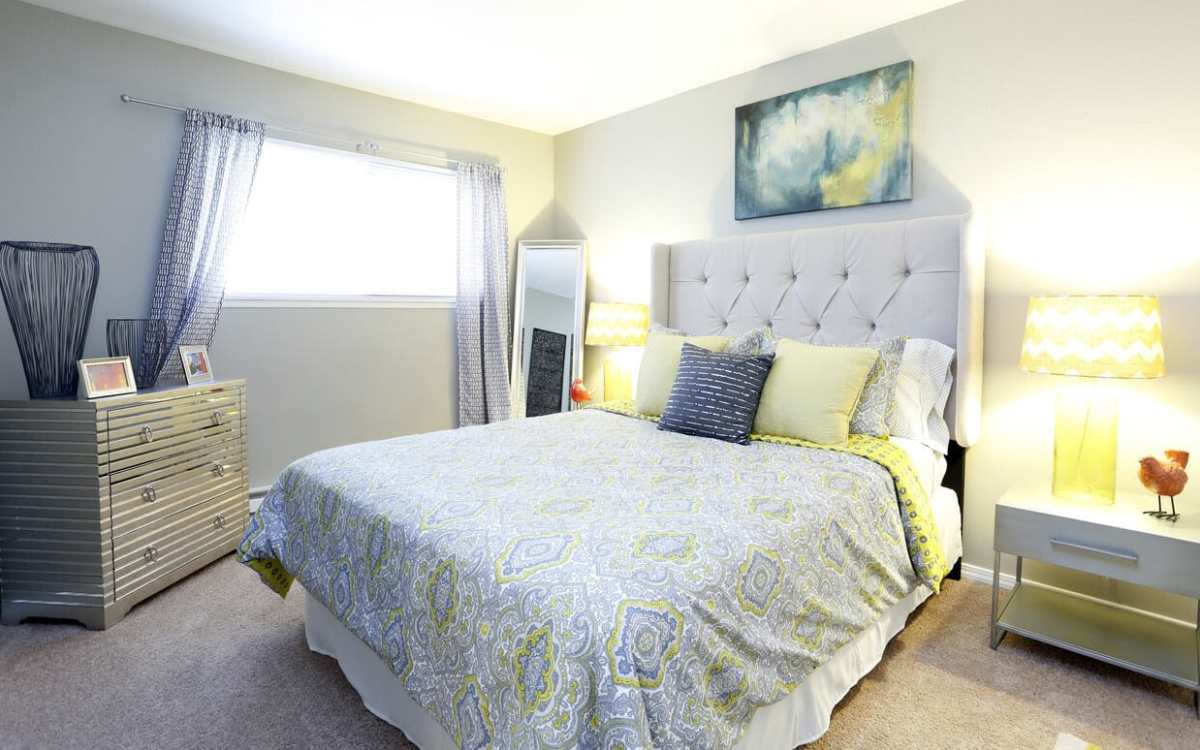 Comfortable bedroom with carpet flooring at Renton Sage in Renton, Washington