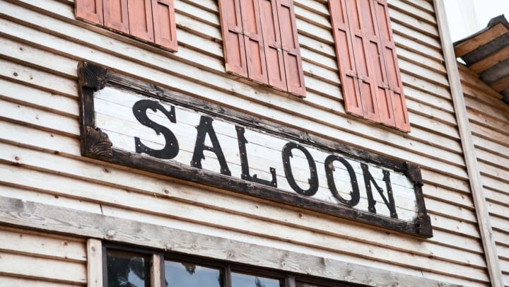 Saloon sign on a building facade