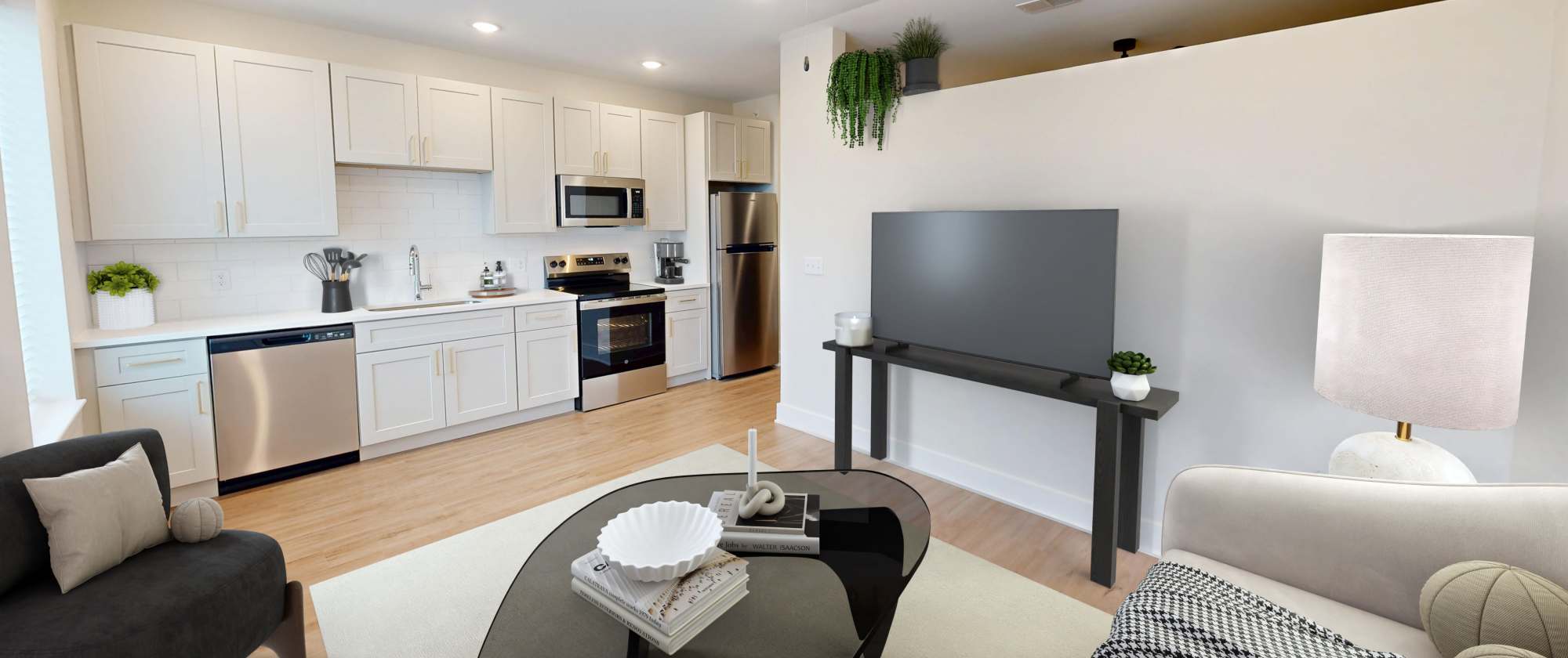 Living room with view of the kitchen at Factory 52 Apartments in Norwood, Ohio
