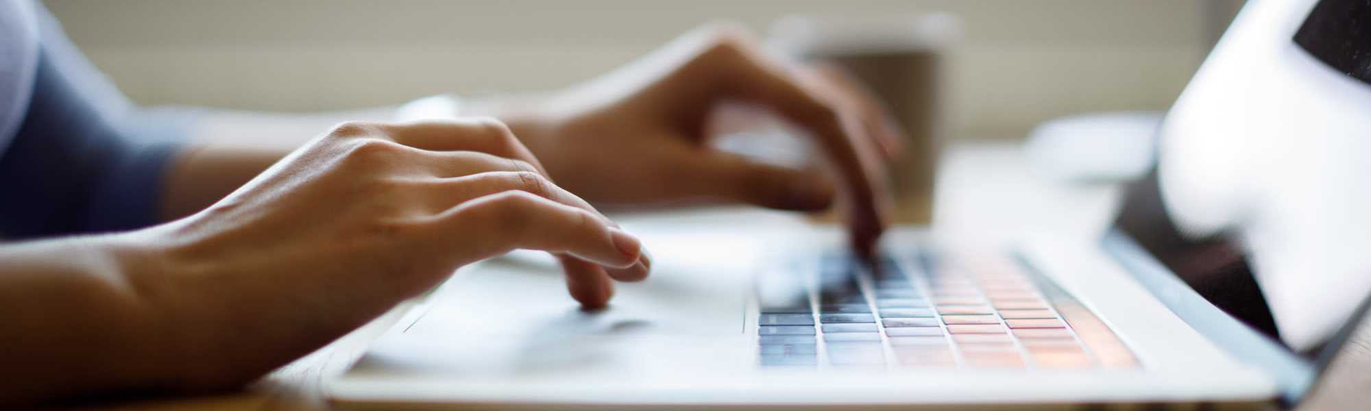 Resident applying in the laptop at Near West Village in Indianapolis, Indiana