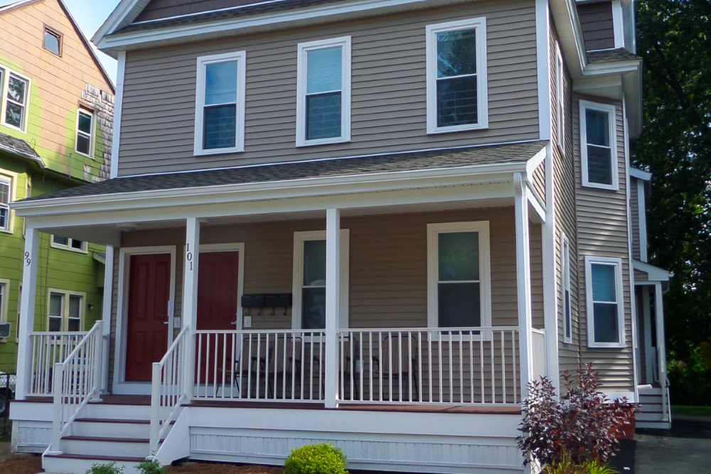 Two-story home with welcoming porch at E. Henry Twiggs Estates Phase I in Springfield, Massachusetts