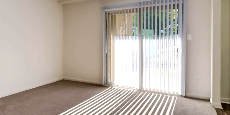 Door to patio letting lots of natural light in at Hallfield Apartments in Nottingham, Maryland