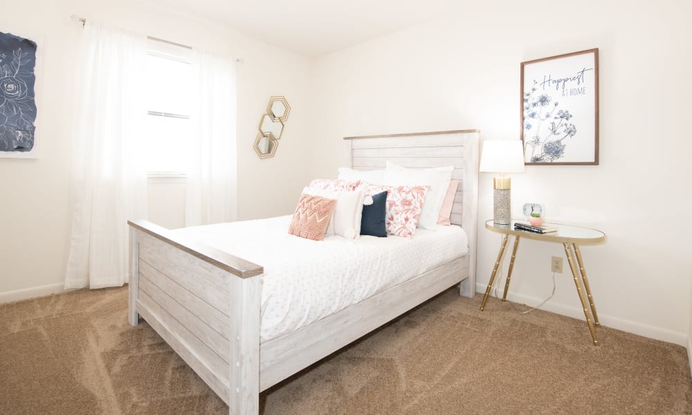 Spacious bedroom with plush carpeting at The Mark Apartments in Ridgeland, Mississippi