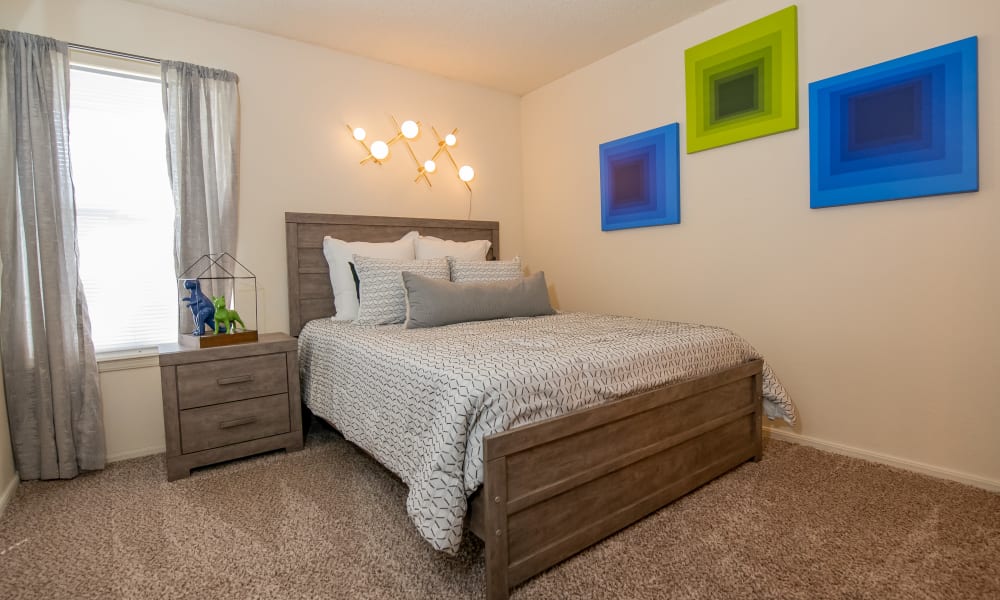 Bright, spacious bedroom at Aspen Park Apartments in Wichita, Kansas