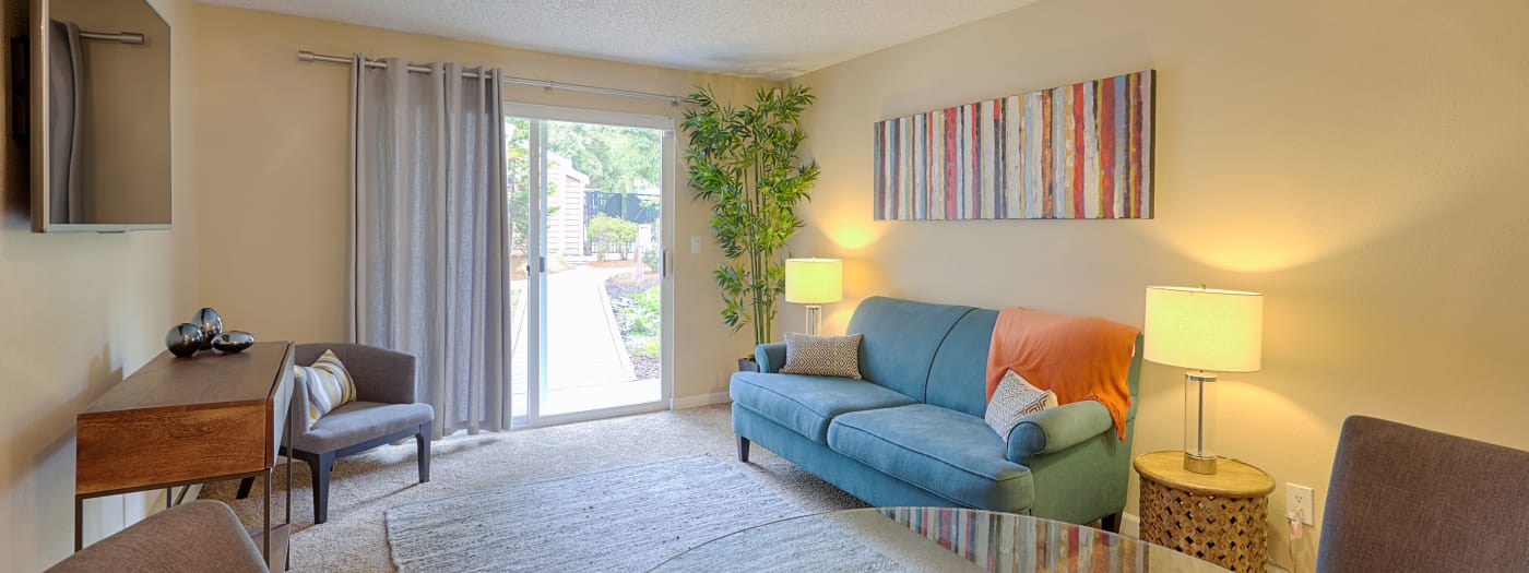 Spacious and well-decorated living area in model home at The Boulevard at South Station Apartment Homes in Tukwila, WA