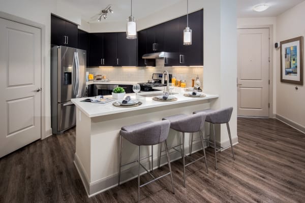 Gourmet kitchen with quartz countertops in a model home at The Core Scottsdale in Scottsdale, Arizona