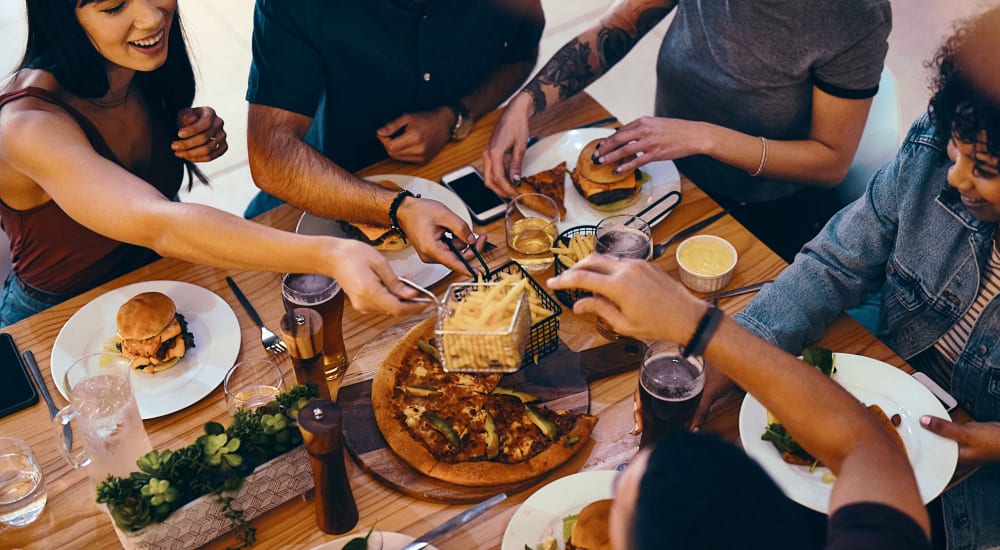 A group of people sitting in a restaurant near Mode at Hyattsville in Hyattsville, Maryland