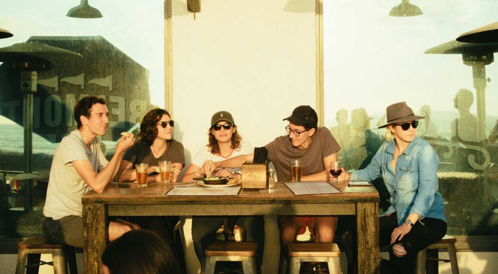 Friends having beer at bar near Dorian and Encore in Plano, Texas