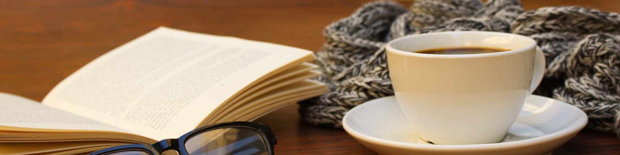 Coffee and a book at Accessibility Statement | Heron Creek Apartments in Moses Lake, Washington