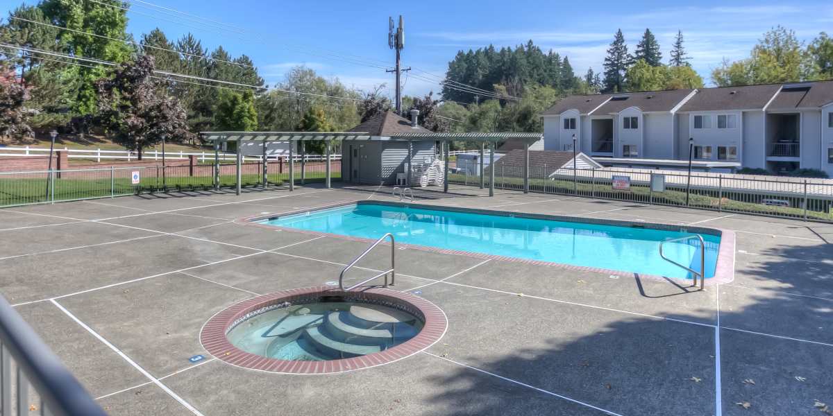 Spacious swimming pool and hot pool for the community at Oak Hill Apartments in Portland, Oregon