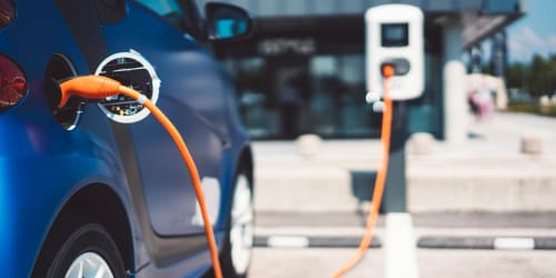 Car parked in the parking with chargers provided for electric vehicles at Douglas Park in Compton, California
