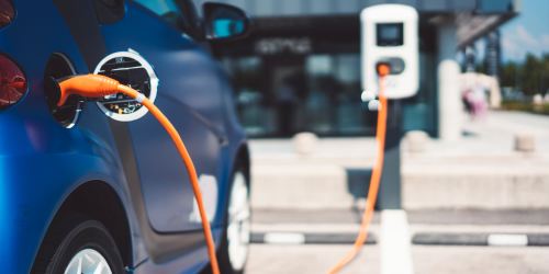 Car parked in the parking with chargers provided for electric vehicles at Douglas Park in Compton, California