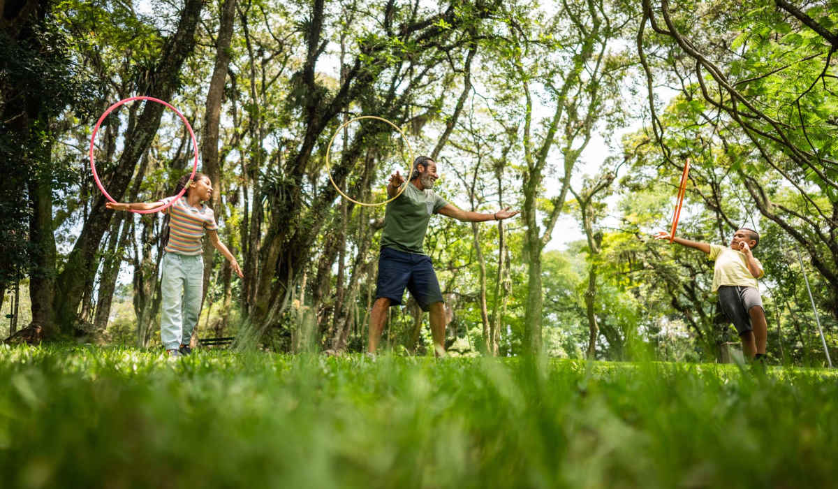 Resident playing with his children at a park near Isles at East Millenia in Orlando, Florida