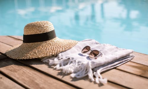 Sun hat by a pool at Bancroft Towers in San Leandro, California