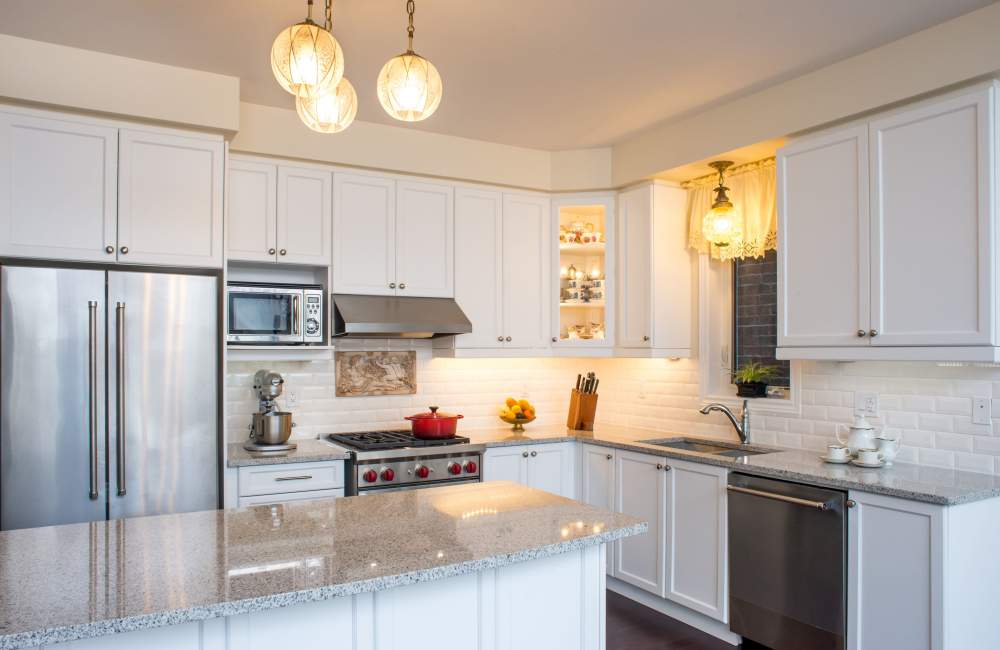 Kitchen with stainless steel appliances, granite countertops and wood cabinetry at Villa Creek in Santa Rosa, California