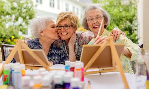 Residents painting together at Glenncrest at Johns Creek in Johns Creek, Georgia