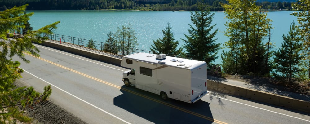 Rv cruising down the road by a nice lake near Parkside Mini Storage and RV in Beaverton, Oregon