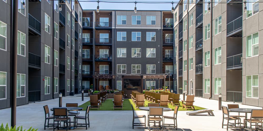 Apartments exterior shot with outdoor seating area at Legends 267 Apartments in Kansas City, Kansas