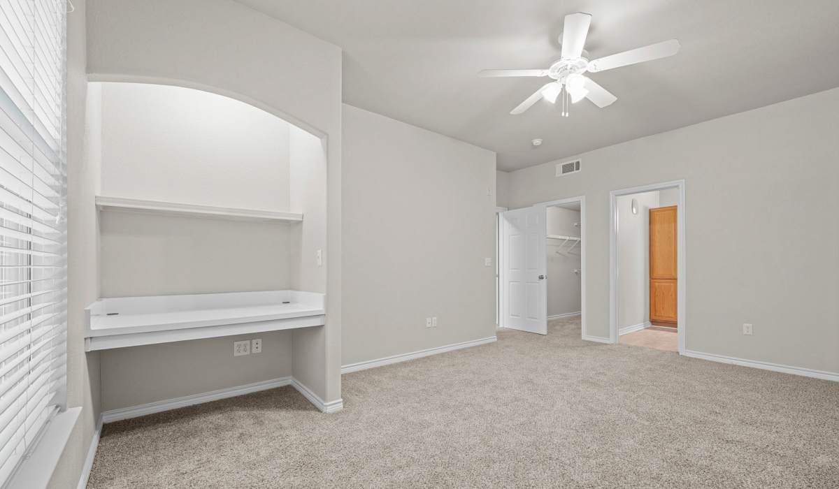 Bedroom with plush carpeting at Hidden Creek in Allen, Texas