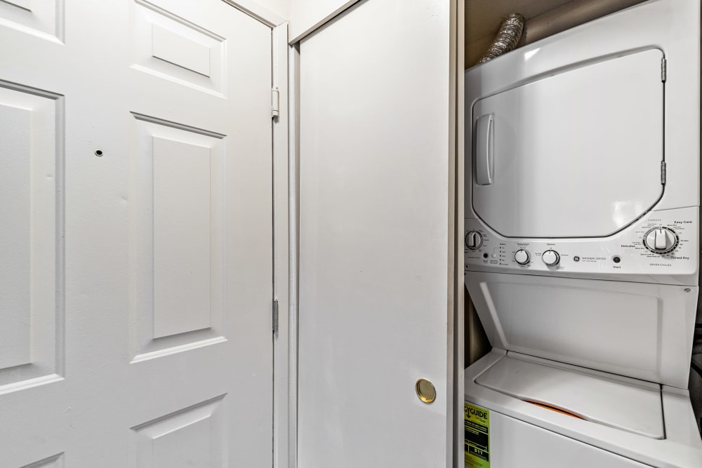 Washer and dryer in a home at Creekside Village Senior Apartment Homes in Pittsburg, California