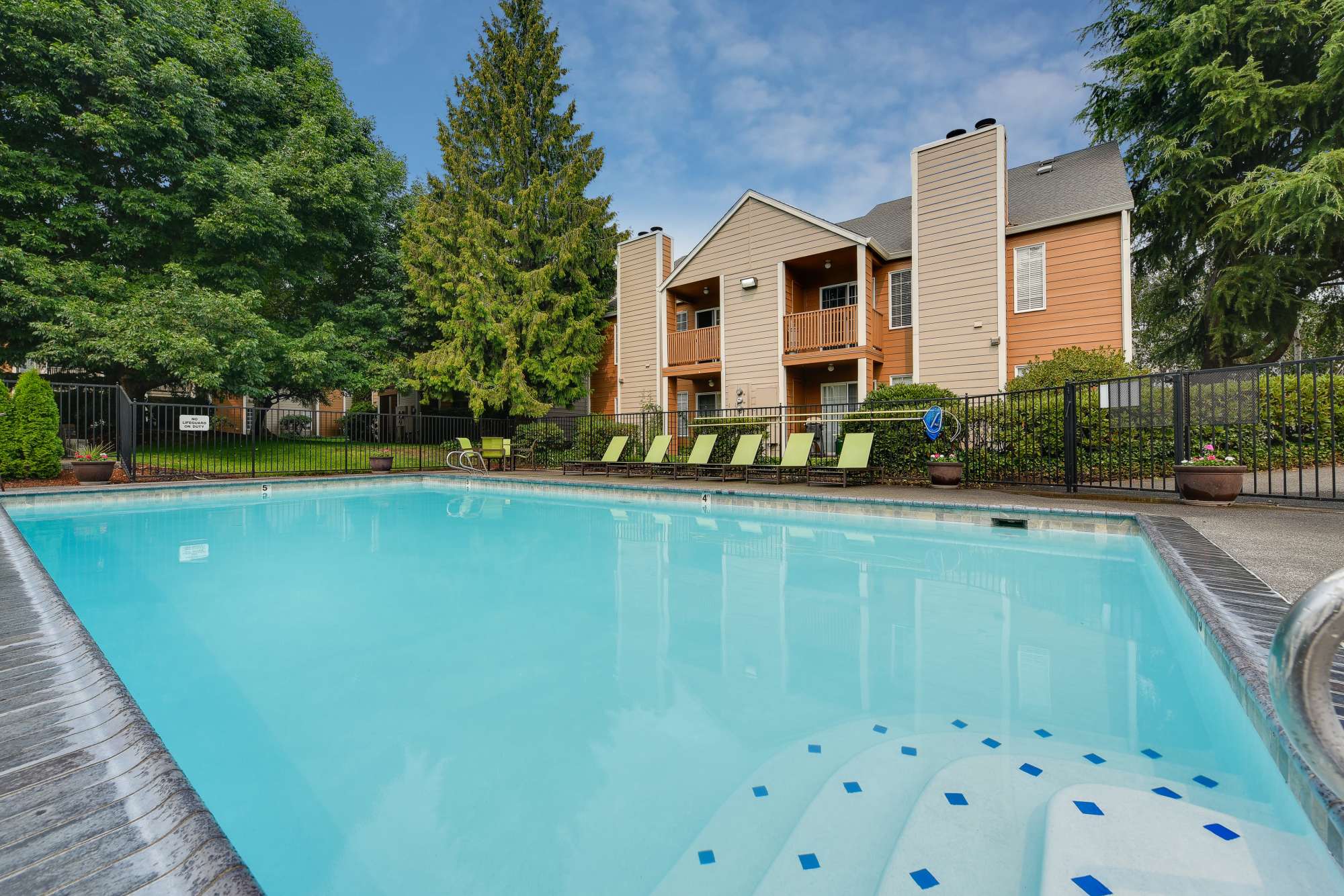 Sparkling swimming pool at Carriage House Apartments in Vancouver, Washington