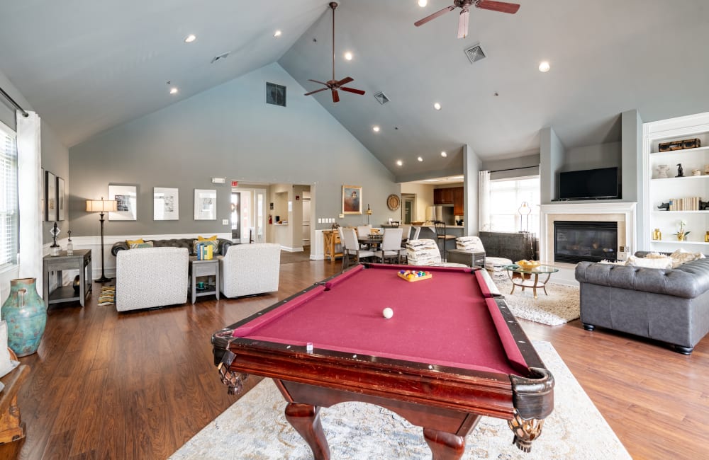 Clubhouse with billiards and lounge seats at Bishop's View Apartments & Townhomes in Cherry Hill, New Jersey