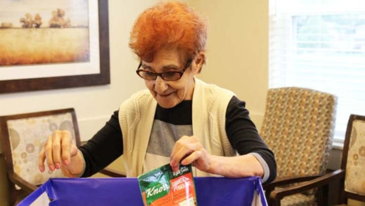 Grace Point Memory Care in Oak Lawn Illinois puts gift boxes together for charity