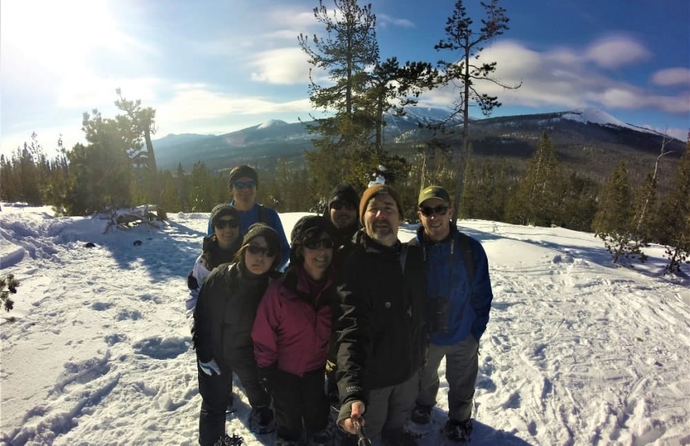 Brian E. Pryor from Touchmark Central Office in Beaverton, Oregon and his family on a snowy mountain