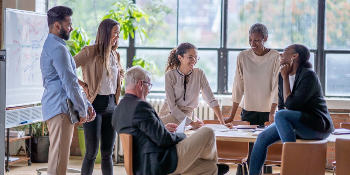 Team having a meeting at SunRidge Management Group in Dallas, Texas