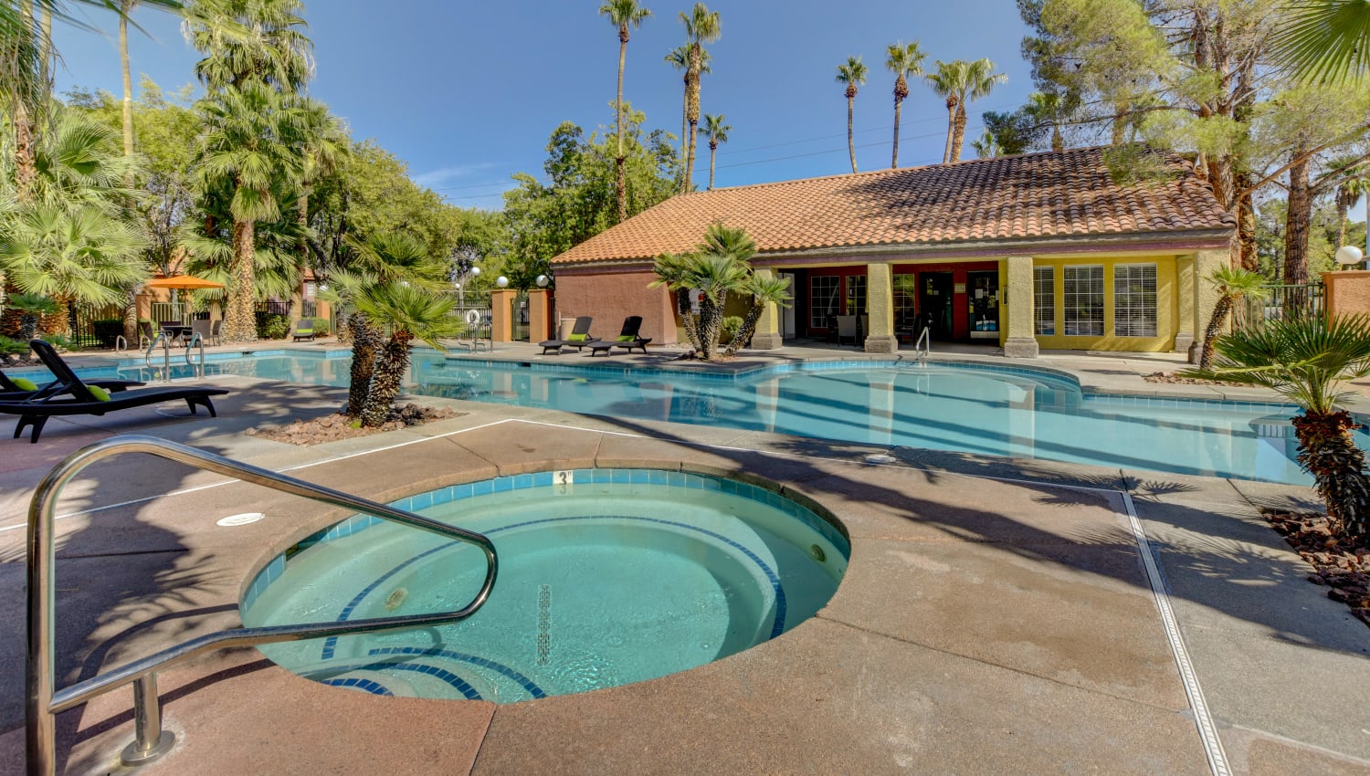 Sparkling pool and spa at Invitational Apartments in Henderson, Nevada
