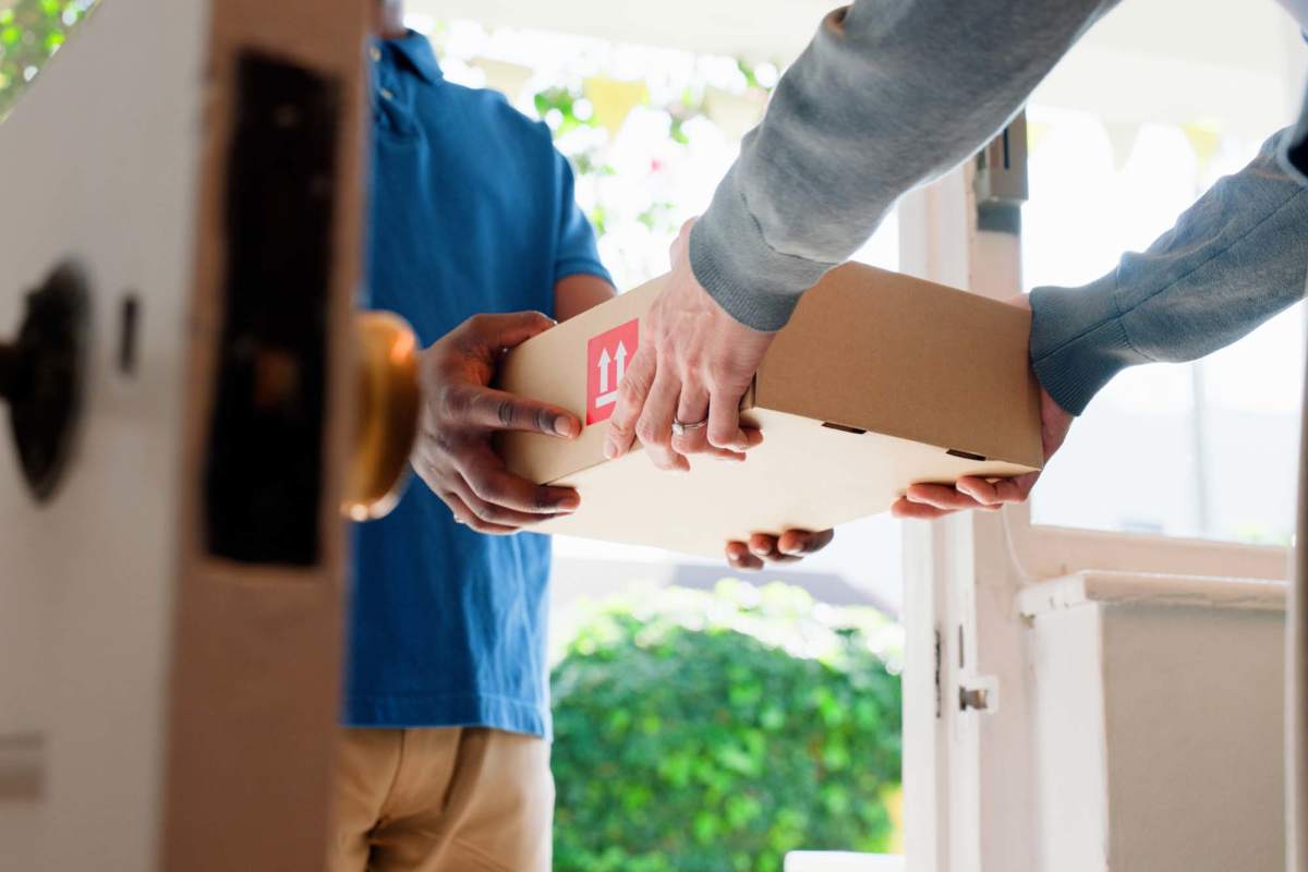 Resident receiving package at Rowan Court in Monroe, Louisiana