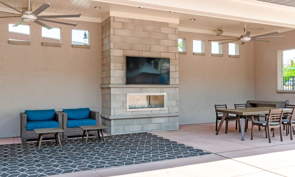 Exterior lounge chairs with fire place at The Residences at Annapolis Junction in Annapolis Junction, Maryland