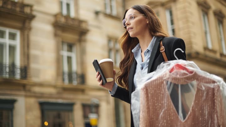 Woman with coffee dry cleaning