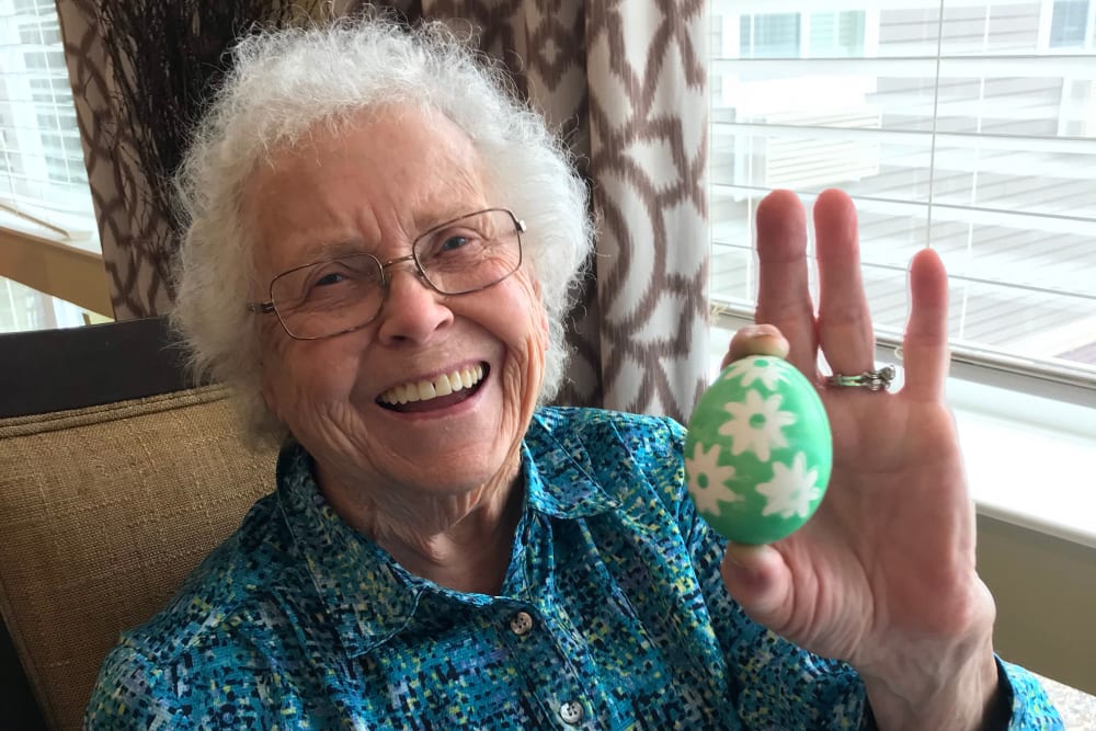 Resident decorating an Easter egg at Edencrest at Siena Hills in Ankeny, Iowa
