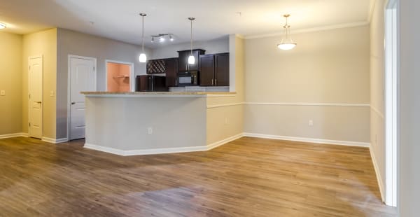 Kitchen with a breakfast overlooking the living room in a model apartment home at Ansley Commons Apartment Homes in Ladson, South Carolina