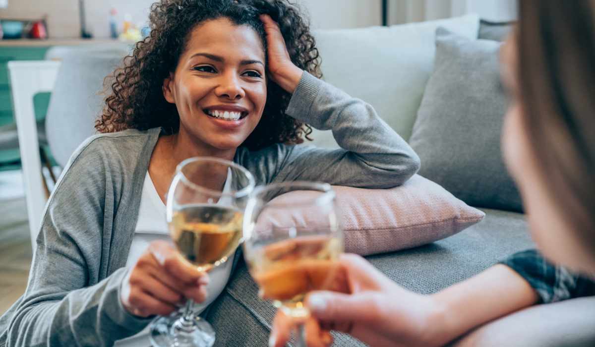 Friends drinking wine at Brentwood Apartments in Portland, Oregon