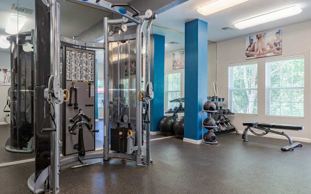 Well-equipped fitness center with cardio equipment at Hampton Greene Apartment Homes in Columbia, South Carolina